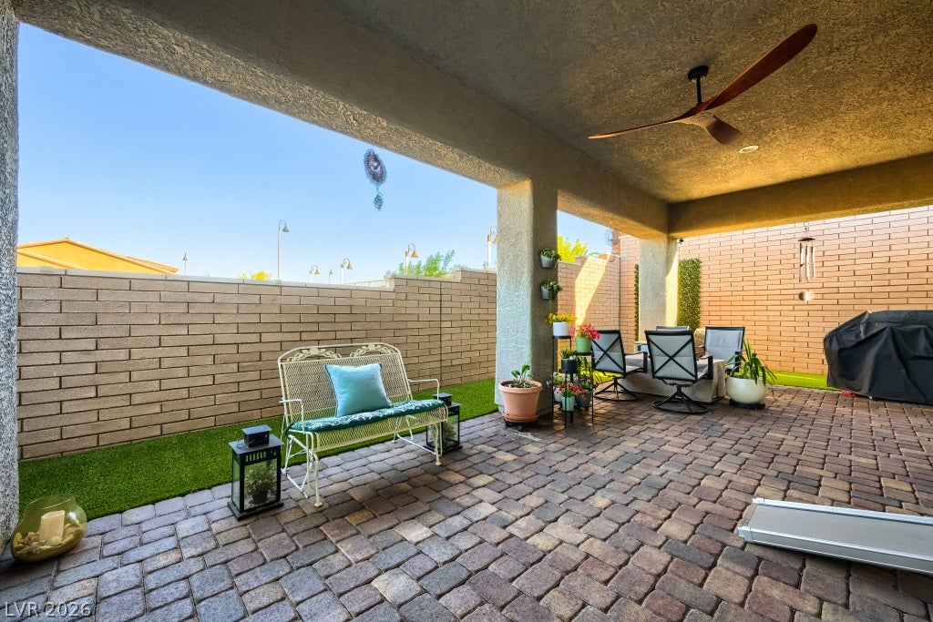 752 Dorsey Falls Street, Henderson, NV 89011 A spacious covered patio paved with brick stones opens to a private walled backyard.