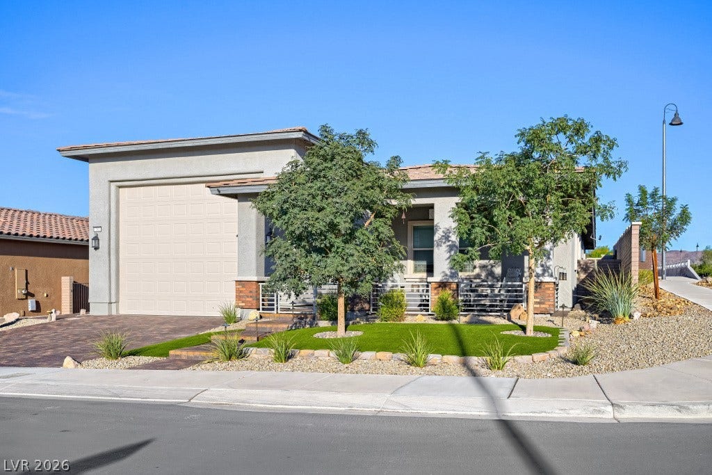 752 Dorsey Falls Street, Henderson, NV 89011 A classic tile roof and manicured front lawn enhance the exterior appeal of this home.