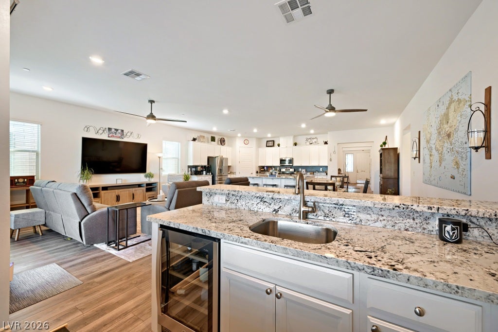 752 Dorsey Falls Street, Henderson, NV 89011 An open floorplan seamlessly connects the granite-countertop wet bar to the main living areas.