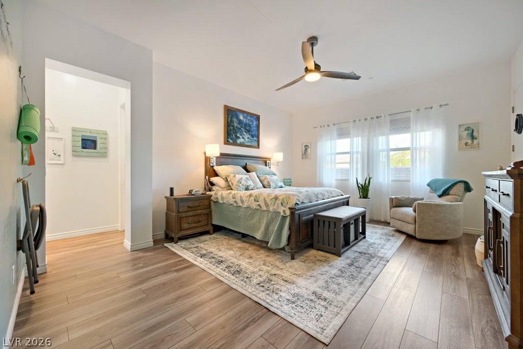 752 Dorsey Falls Street, Henderson, NV 89011 Smooth wood-look flooring and tall windows create a tranquil and airy sleeping retreat.