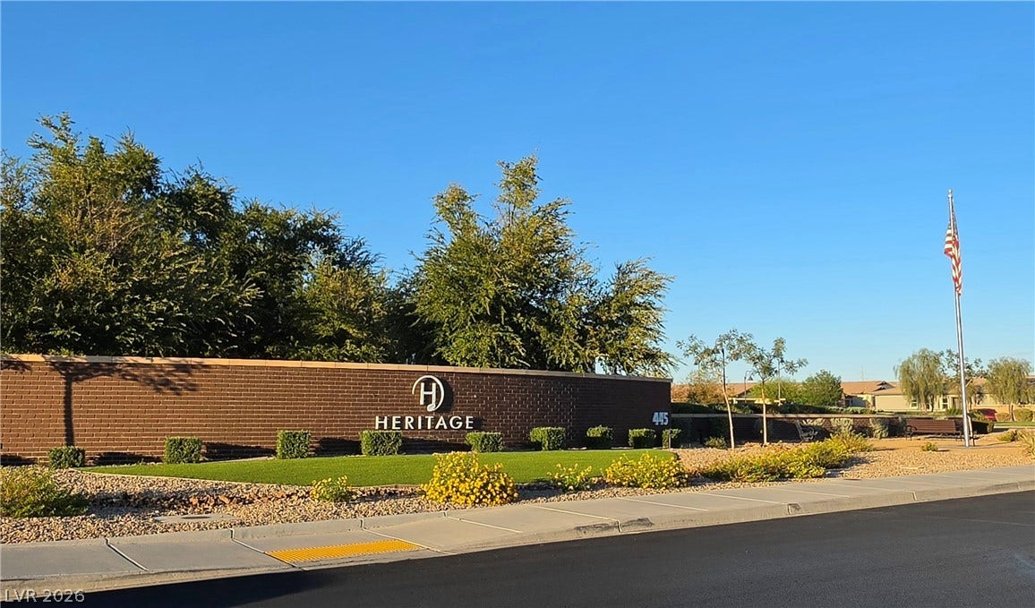 752 Dorsey Falls Street, Henderson, NV 89011 Manicured landscaping and brick monument signage frame the entrance to the community.