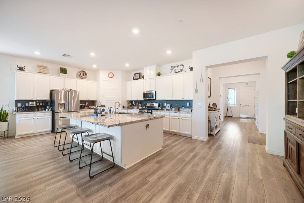 752 Dorsey Falls Street, Henderson, NV 89011 An open kitchen layout showcases a central island and seamless transitions to the entryway.