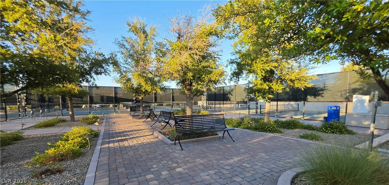 752 Dorsey Falls Street, Henderson, NV 89011 Paved walkways wind past mature shade trees toward the community tennis courts.