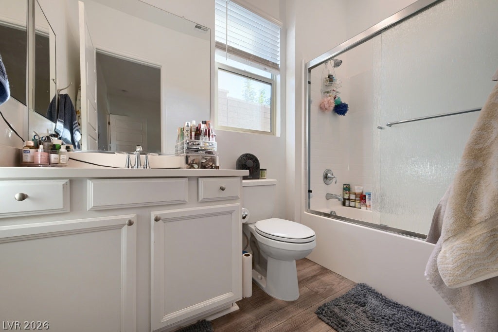 752 Dorsey Falls Street, Henderson, NV 89011 Natural light from a classic window illuminates this clean bathroom with durable wood-look flooring.