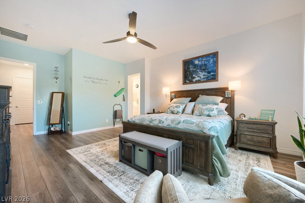 752 Dorsey Falls Street, Henderson, NV 89011 Smooth wood-plank flooring and clean architectural lines define this welcoming and comfortable bedroom suite.