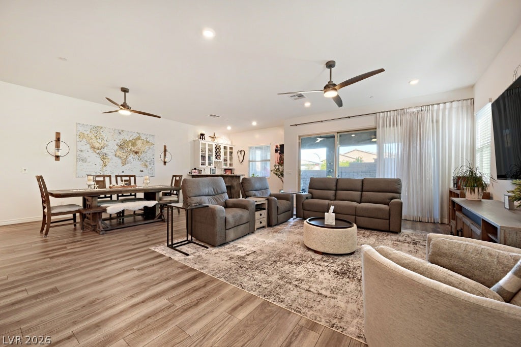 752 Dorsey Falls Street, Henderson, NV 89011 An open-concept living area displays durable wood-look flooring and recessed lighting.