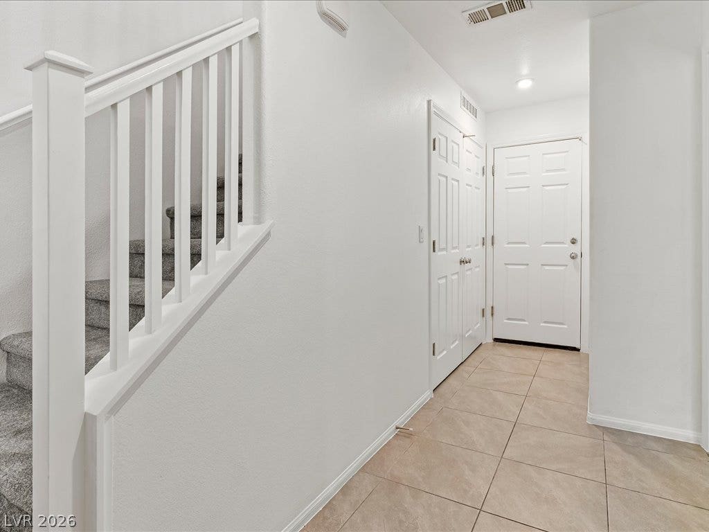 671 Foam Flower Lane, Henderson, NV 89015 Tiled flooring and a neutral color palette welcome visitors into this entryway space.