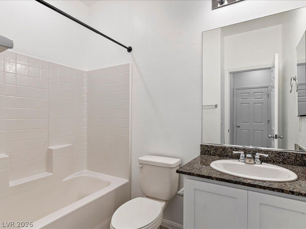 671 Foam Flower Lane, Henderson, NV 89015 Granite counters and neat wall tiling define this clean secondary bathroom space.