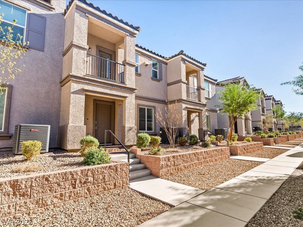 671 Foam Flower Lane, Henderson, NV 89015 Stucco exteriors and neat concrete walkways create clean curb appeal for these multi-level residences.