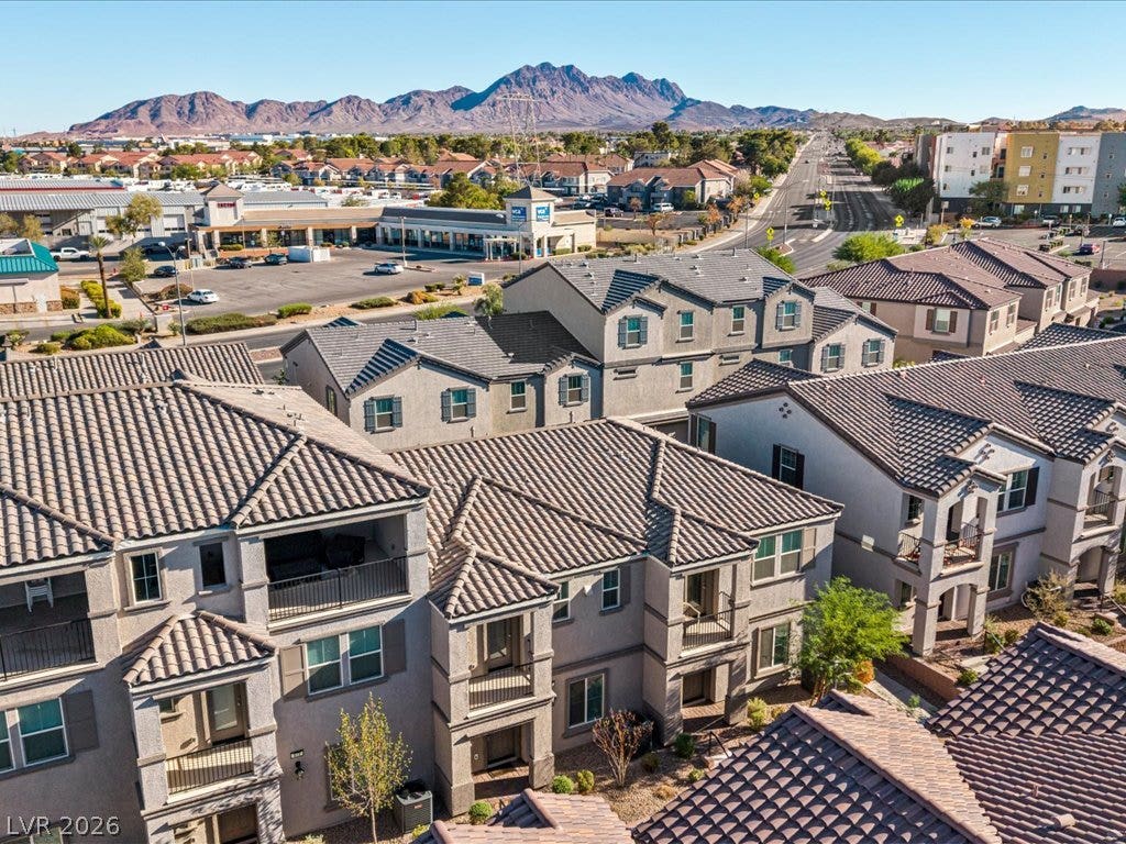 671 Foam Flower Lane, Henderson, NV 89015 Scenic mountain vistas frame this neighborhood of multi-level residences featuring tiled roofs and private balconies.