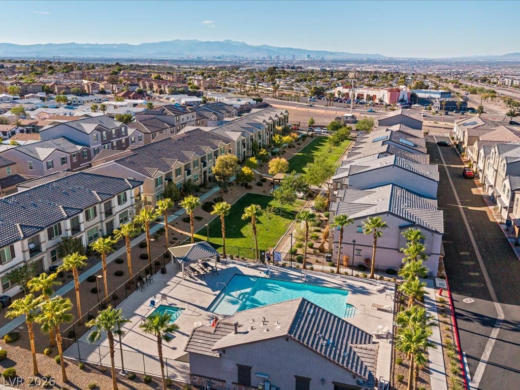 671 Foam Flower Lane, Henderson, NV 89015 A sparkling community pool anchors this neighborhood layout framed by distant mountain peaks.