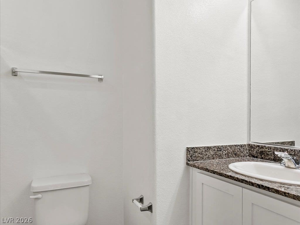 671 Foam Flower Lane, Henderson, NV 89015 Polished stone counters elevate this clean and contemporary washroom space.