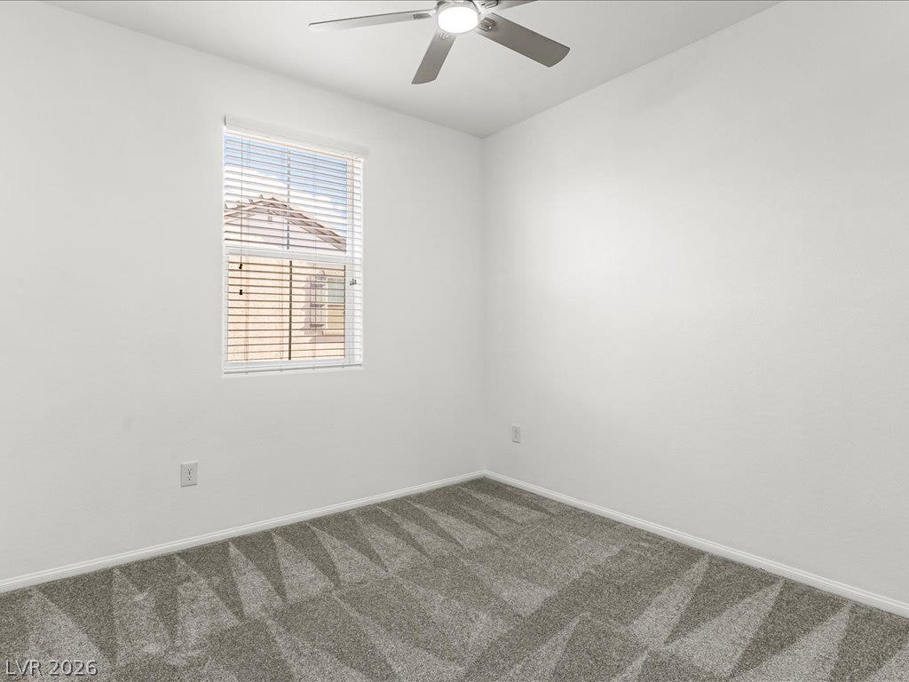 671 Foam Flower Lane, Henderson, NV 89015 Plush wall-to-wall carpeting and clean neutral walls define this versatile room.