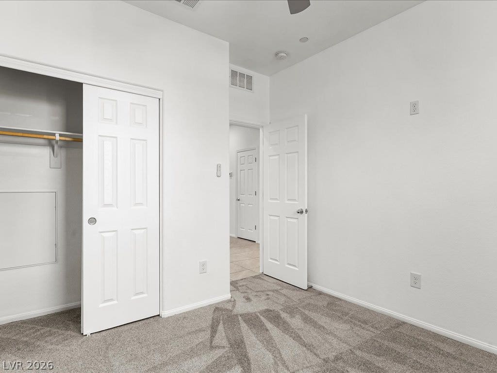 671 Foam Flower Lane, Henderson, NV 89015 Soft carpeting underfoot provides cozy comfort in this modern bedroom featuring a private closet.