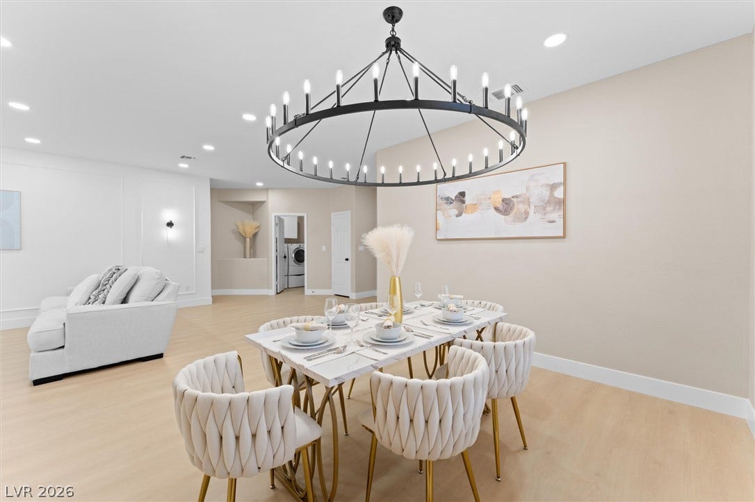 2163 Chapman Ranch Drive, Henderson, NV 89012 Smooth wood floors and modern recessed lighting enhance this open-concept dining area.