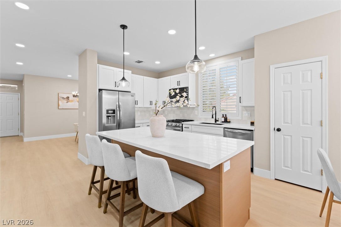 2163 Chapman Ranch Drive, Henderson, NV 89012 An open kitchen layout features clean lines, recessed lighting, and a central island.