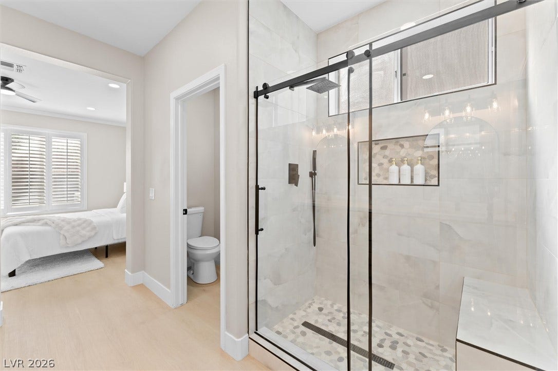 2163 Chapman Ranch Drive, Henderson, NV 89012 Clean lines and a spacious tile shower define this modern primary bath design.