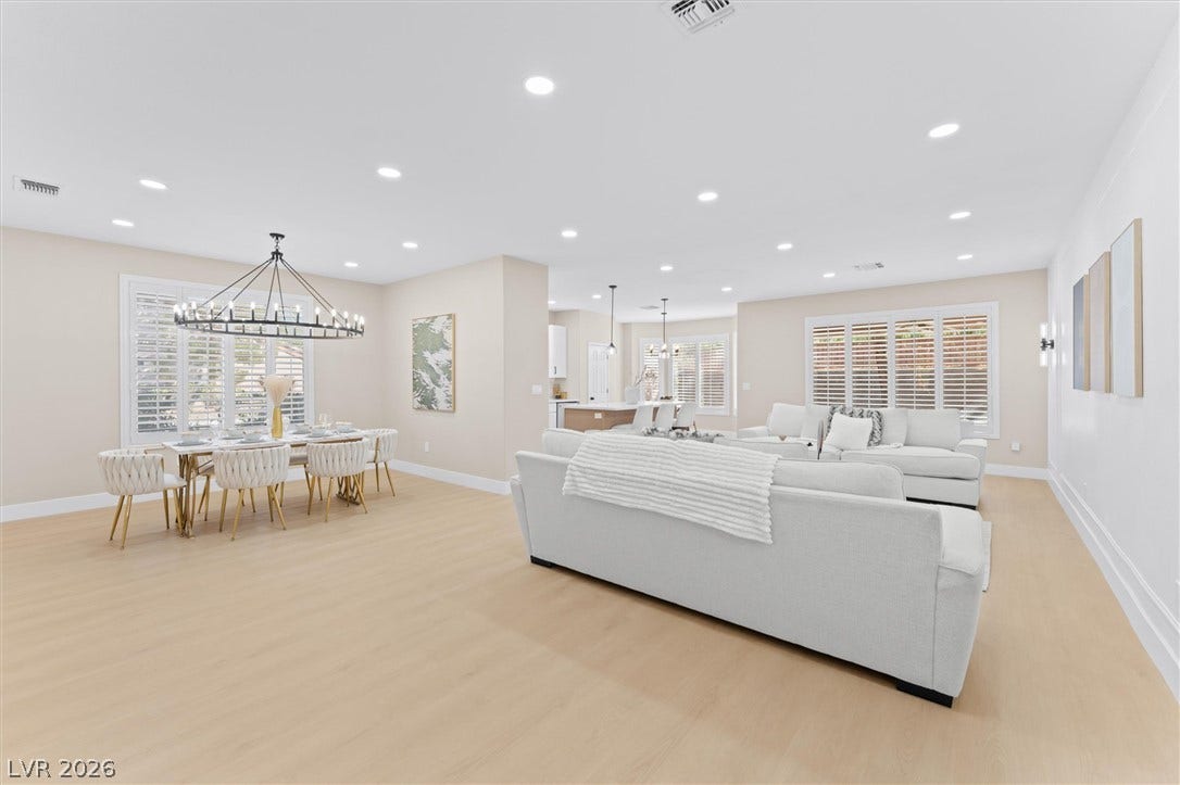 2163 Chapman Ranch Drive, Henderson, NV 89012 Recessed lighting illuminates this seamless open floorplan connecting the living and dining spaces.
