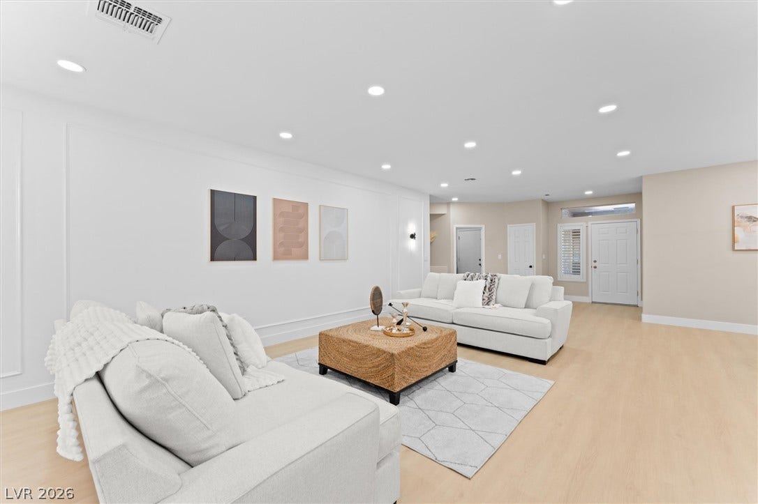 2163 Chapman Ranch Drive, Henderson, NV 89012 Recessed lighting and light-toned flooring define this spacious living area.