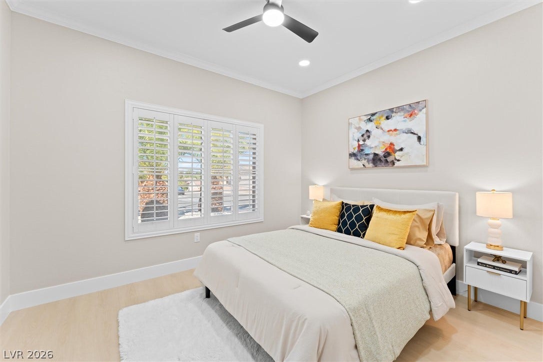 2163 Chapman Ranch Drive, Henderson, NV 89012 Crisp crown molding and plantation shutters enhance this modern sleeping space.