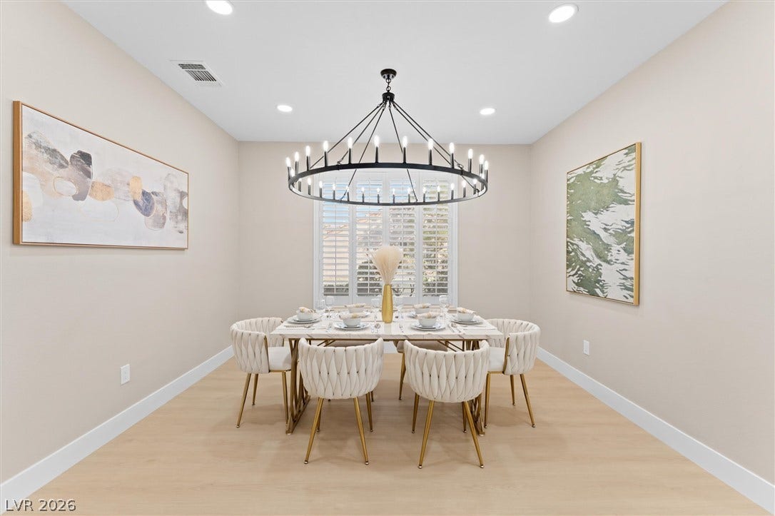 2163 Chapman Ranch Drive, Henderson, NV 89012 Smooth wood floors anchor this dining room beneath a clean ceiling with inset lighting.