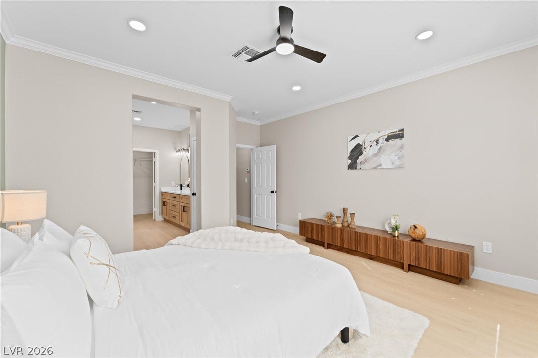 2163 Chapman Ranch Drive, Henderson, NV 89012 Crisp crown molding and smooth wood floors define this tranquil bedroom suite.