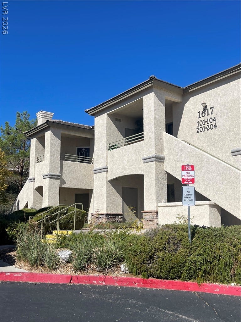 1617 Queen Victoria Street, #201, Las Vegas, NV 89144 A multi-level stucco exterior integrates private balconies , front entry porch and landscaped grounds.