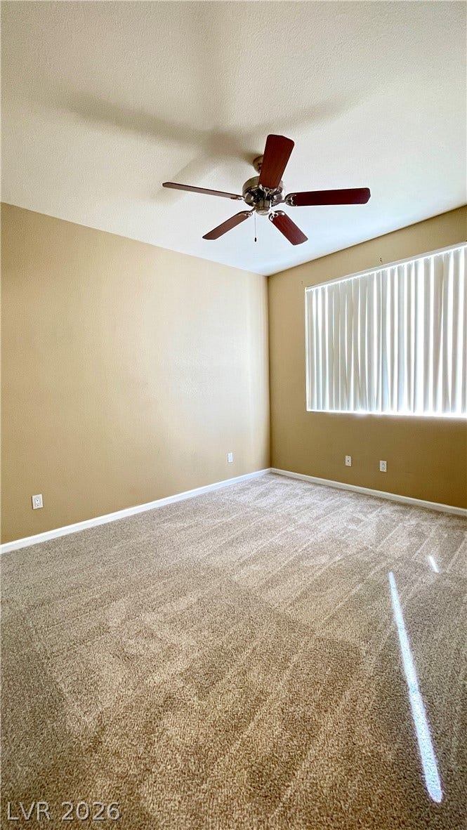 1617 Queen Victoria Street, #201, Las Vegas, NV 89144 Plush carpeting anchors this versatile room underneath high ceilings illuminated by natural light.