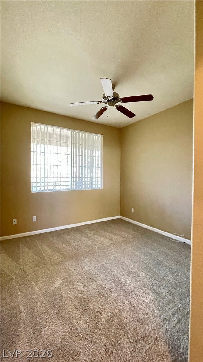 1617 Queen Victoria Street, #201, Las Vegas, NV 89144 Plush carpeting and a large window create a comfortable and welcoming atmosphere.