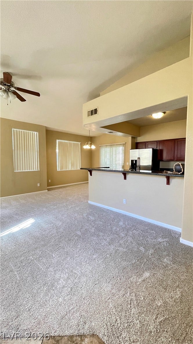 1617 Queen Victoria Street, #201, Las Vegas, NV 89144 Vaulted ceilings and soft carpeting flow throughout this expansive open floor plan.