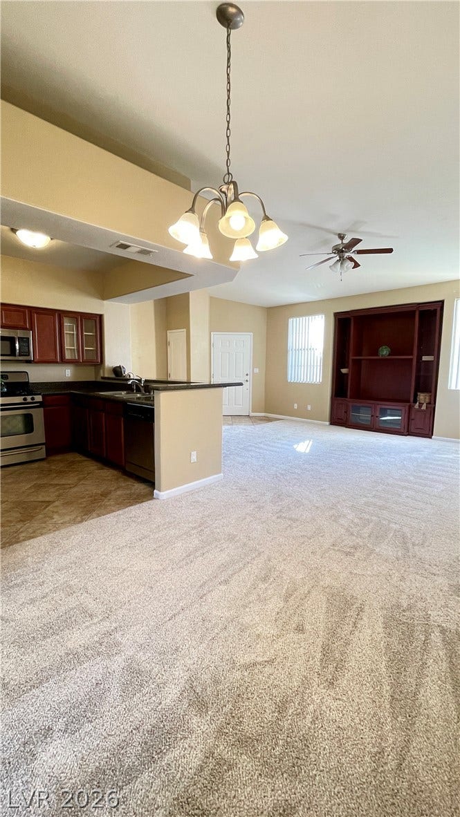 1617 Queen Victoria Street, #201, Las Vegas, NV 89144 Plush new carpeting and an open layout connect the inviting living spaces seamlessly.