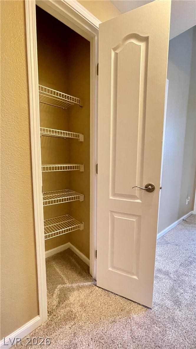 1617 Queen Victoria Street, #201, Las Vegas, NV 89144 Functional wire shelving provides organized storage space inside a convenient linen closet.