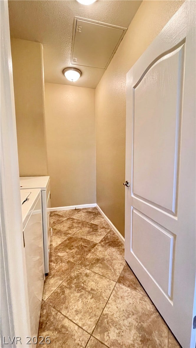 1617 Queen Victoria Street, #201, Las Vegas, NV 89144 Tiled flooring and a classic paneled door define this functional service space.