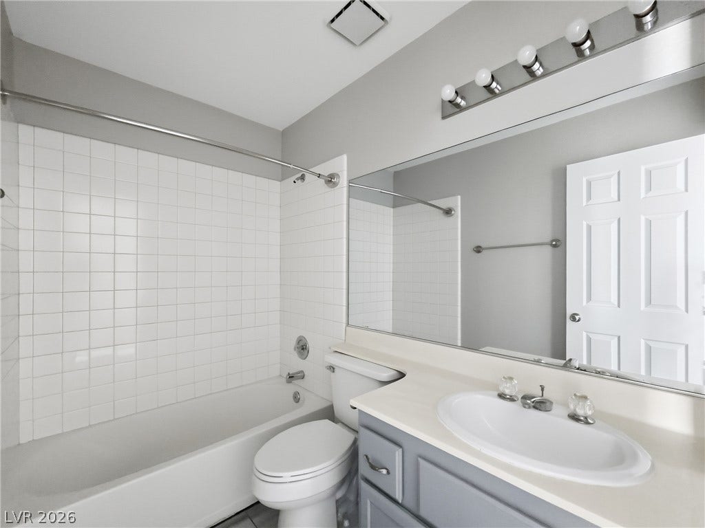 Clean lines and classic tiling define this functional bathroom layout.