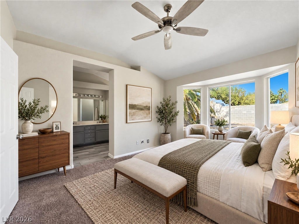 ** Virtually Staged** A spacious bedroom features cozy carpeting and a bright bay window overlooking the yard.