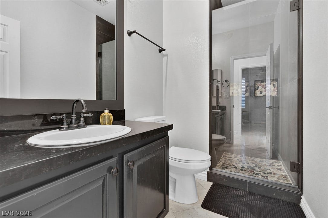 9529 Grand Canal Drive, Las Vegas, NV 89117 Across the hall from the first floor bedroom