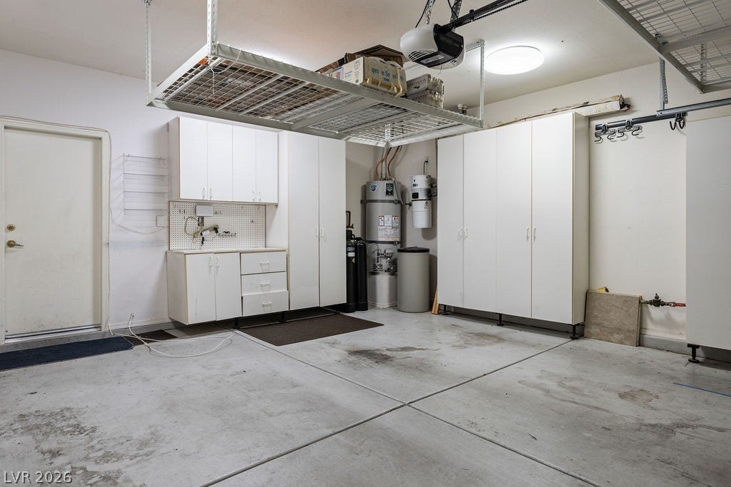 This organized garage offers extensive storage and utility, perfect for diverse needs.