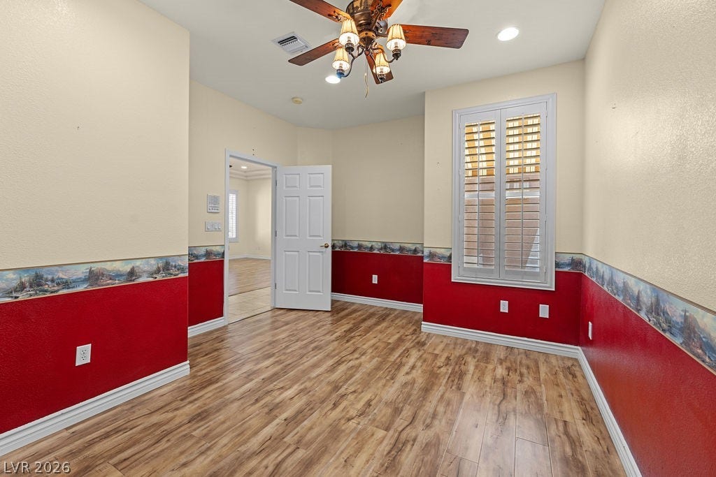This versatile room features warm flooring and a cooling ceiling fan, perfect for any lifestyle.