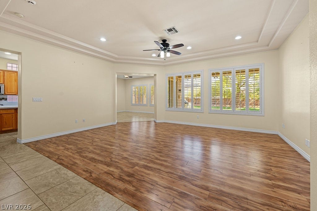 This bright room features beautiful flooring and ample natural light, perfect for any occasion.