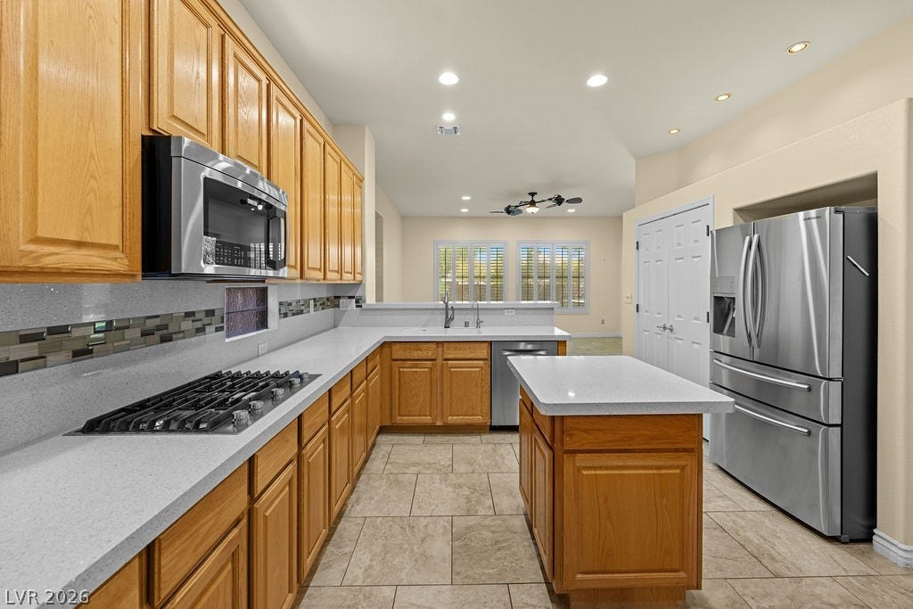 This bright kitchen features modern appliances and ample counter space, perfect for everyday living.