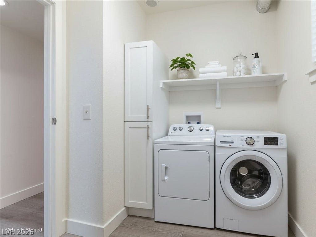 3708 Heritage Avenue, Las Vegas, NV 89121 Crisp modern cabinetry and open shelving maximize storage space in this functional laundry room.