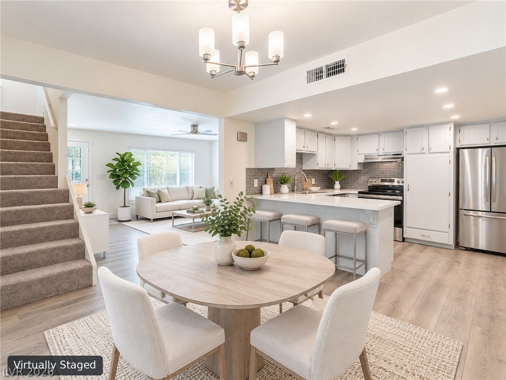 3708 Heritage Avenue, Las Vegas, NV 89121 An open-concept layout seamlessly connects the dining space, modern kitchen, and adjacent living areas.