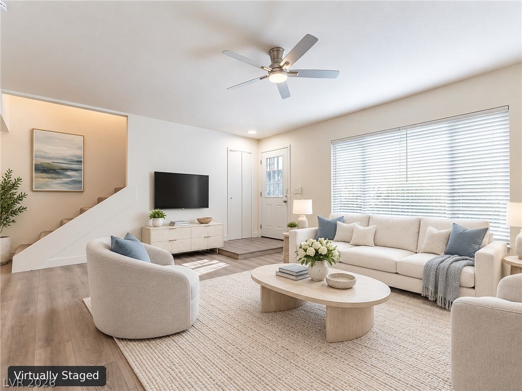 3708 Heritage Avenue, Las Vegas, NV 89121 Warm wood flooring and abundant natural light create a welcoming main living area.