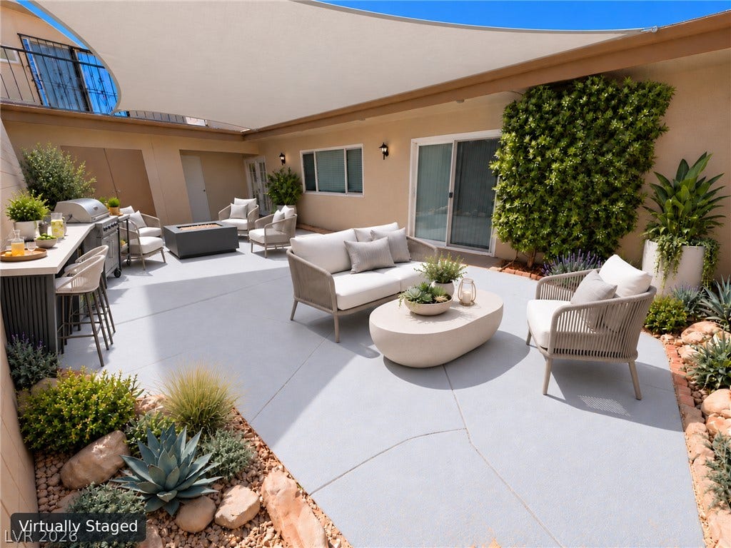 3708 Heritage Avenue, Las Vegas, NV 89121 An inviting concrete patio provides a spacious outdoor retreat bordered by low-maintenance landscaping.