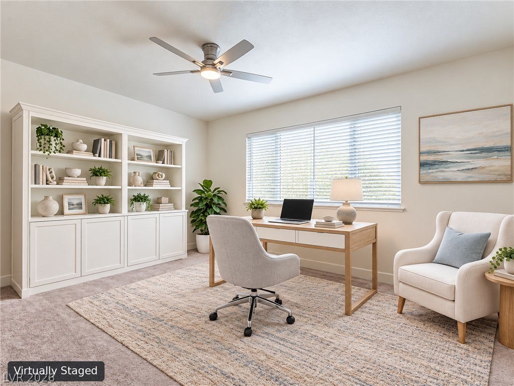 3708 Heritage Avenue, Las Vegas, NV 89121 An expansive window illuminates this versatile workspace featuring integrated shelving and soft carpet floors.