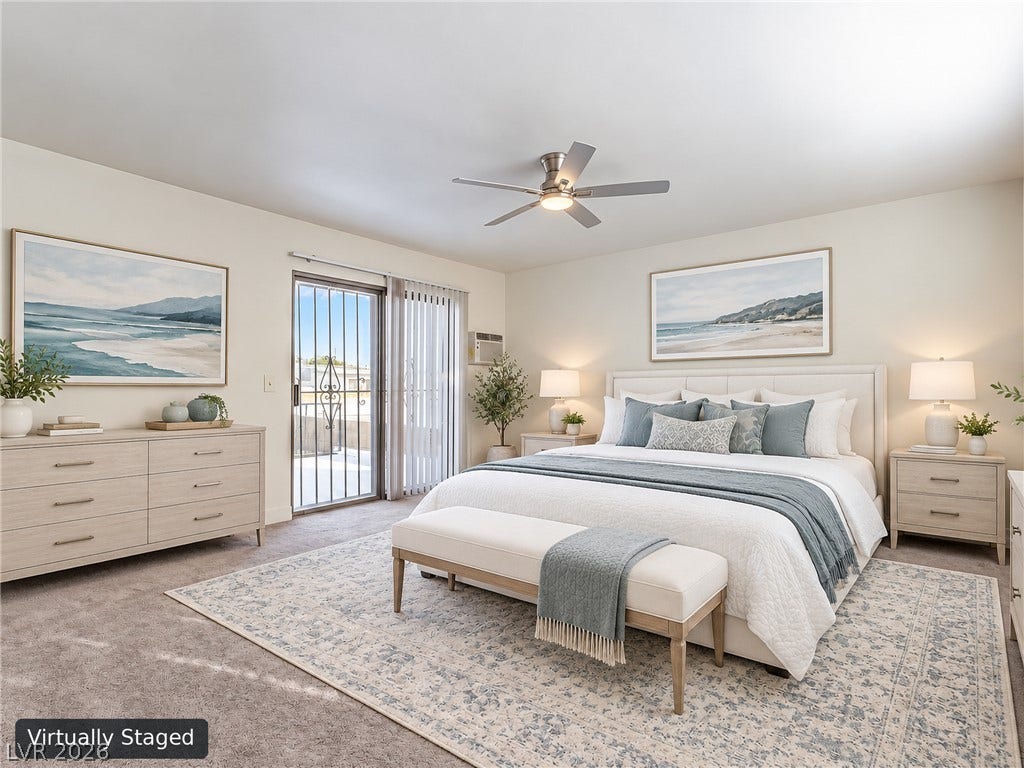 3708 Heritage Avenue, Las Vegas, NV 89121 Glass sliding doors open to a private balcony from this spacious bedroom.