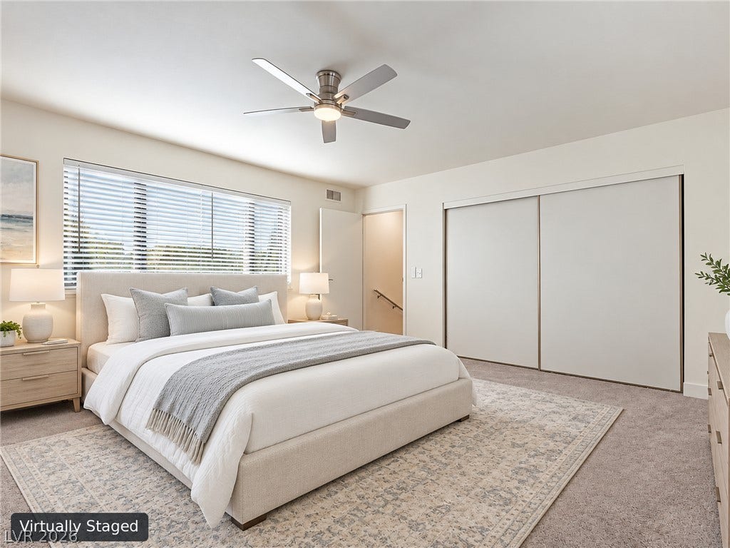 3708 Heritage Avenue, Las Vegas, NV 89121 Plentiful natural light fills this bedroom complete with neutral carpeting and sliding closet doors.