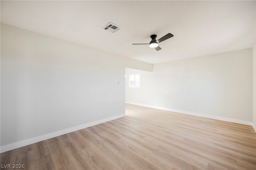 223 W Basic Road, Henderson, NV 89015 Smooth wood-style flooring anchors this versatile open living space.