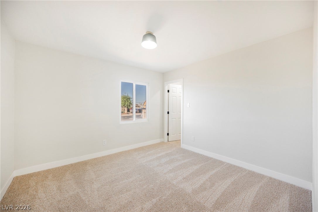 223 W Basic Road, Henderson, NV 89015 Soft carpeting pairs with neutral walls in this comfortable secondary bedroom.