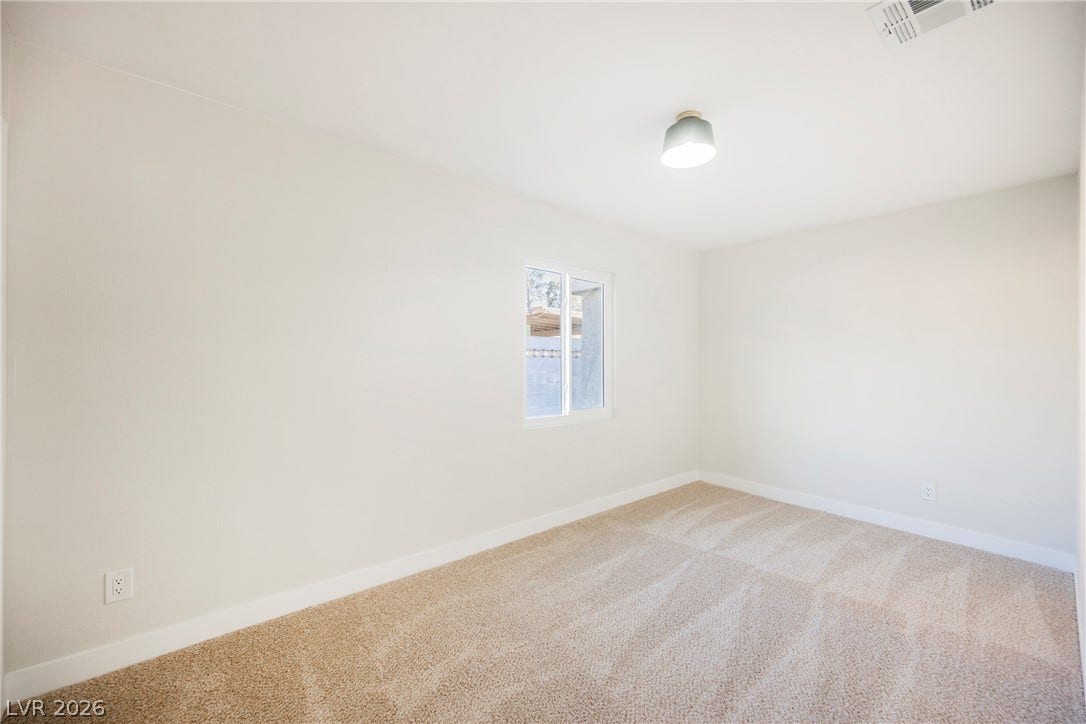 223 W Basic Road, Henderson, NV 89015 Plush carpeting and natural light define this versatile secondary space.